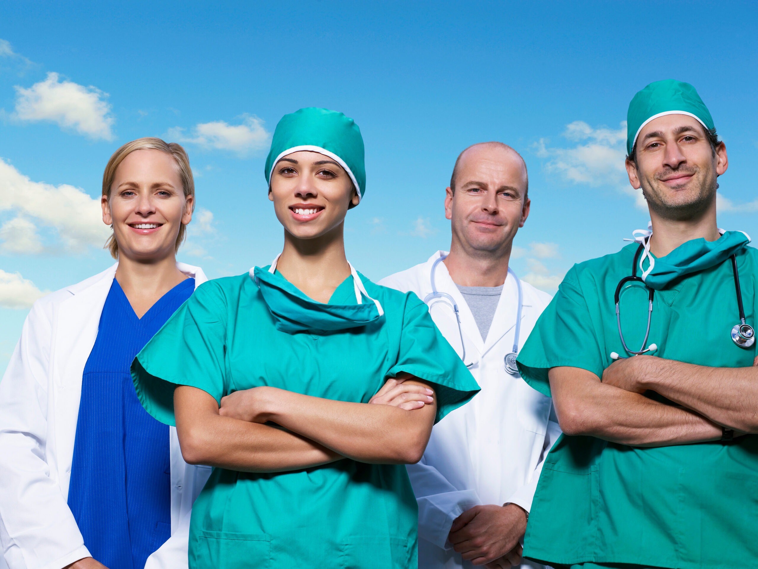 Group of Nurses with clouds in background